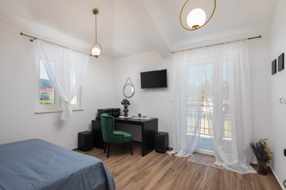 And a balcony overlooking the picturesque sea and pool