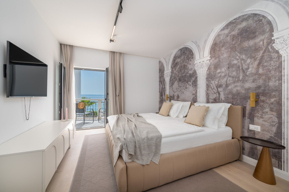 Bedroom NO3 (15,2sqm) with super king size bed 200x200 (can be separated into two singles), A/C, a TV, en-suite bathroom with a shower,  a balcony, and sea-views