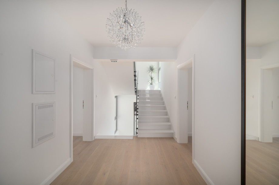 There is also a laundry corner with a washing machine, a dryer, and ironing facilities