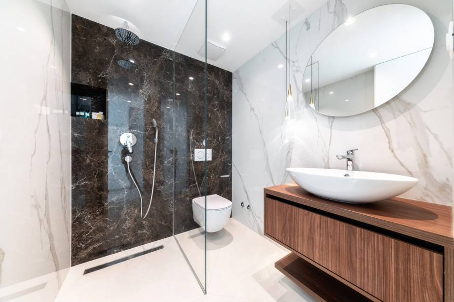 There is a family bathroom with a shower next door