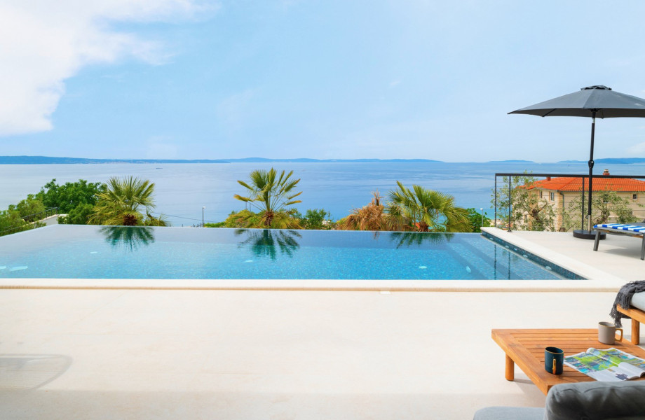 A private, heated infinity 32 sqm (8m x 4m) swimming pool with a fully automated salt electrolysis system