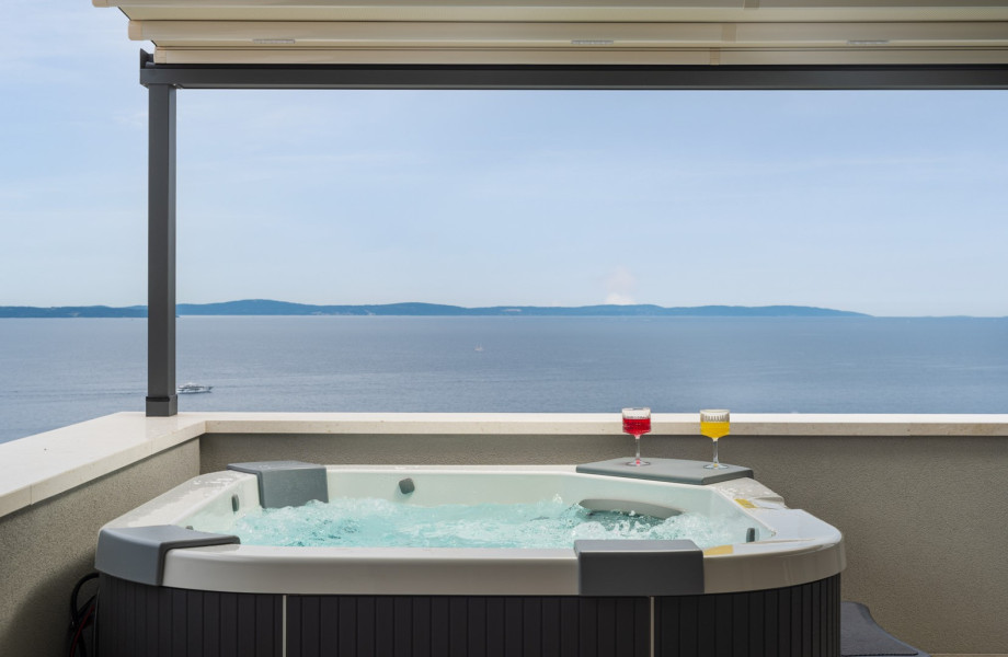 four en-suite bedrooms, a sauna, and whirlpool, all conveniently located just 1km from the beach.