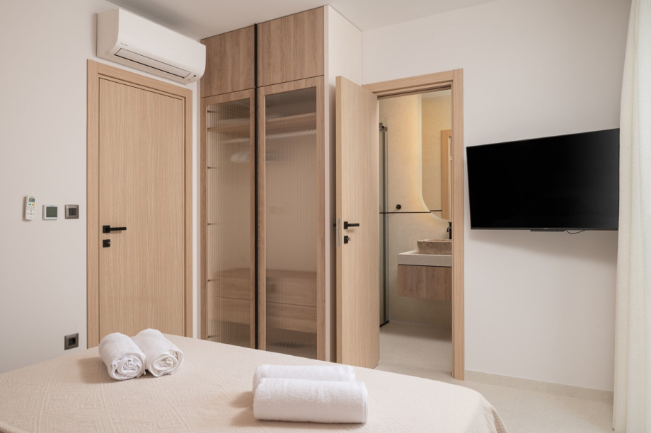 The bedroom is extremely comfortable and equipped with air conditioning and a TV.