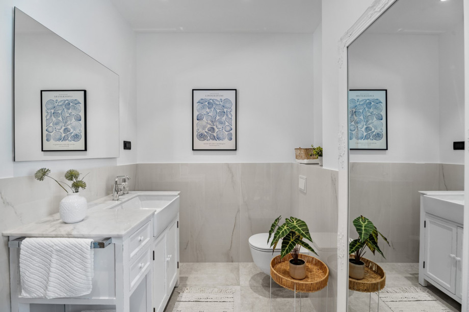 A family bathroom  with a shower and a toilet