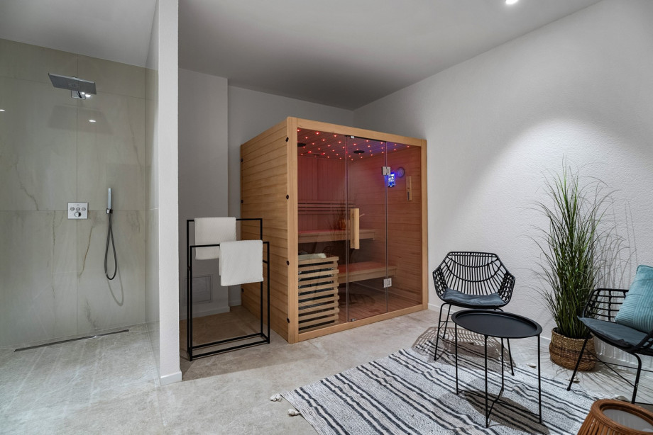 For ultimate relaxation, the villa features a luxurious basement retreat complete with a Finnish sauna and a relaxing zone.