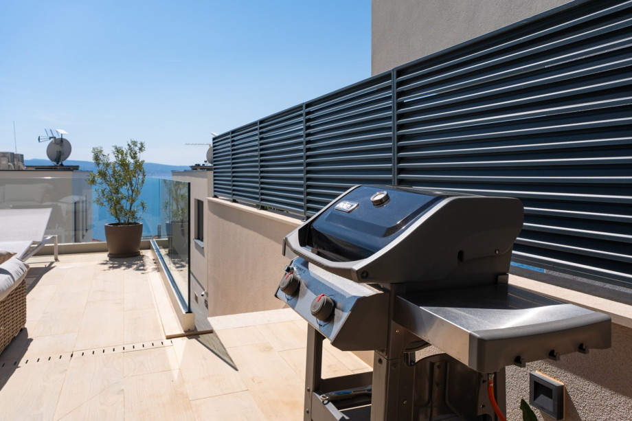 Complemented by a gas barbecue for delightful outdoor meals.