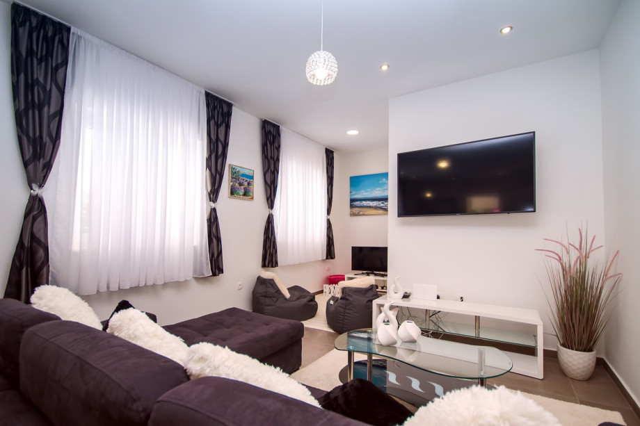 Living area with additional TV and PS, a corner for older kids :)