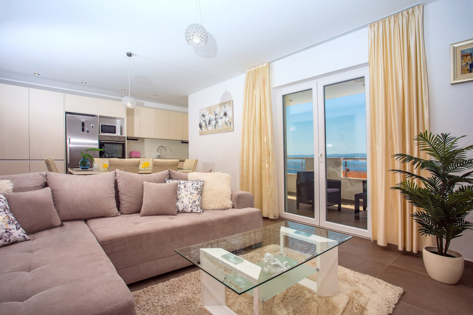 Kitchen with dining and living area on the 1st floor, balcony