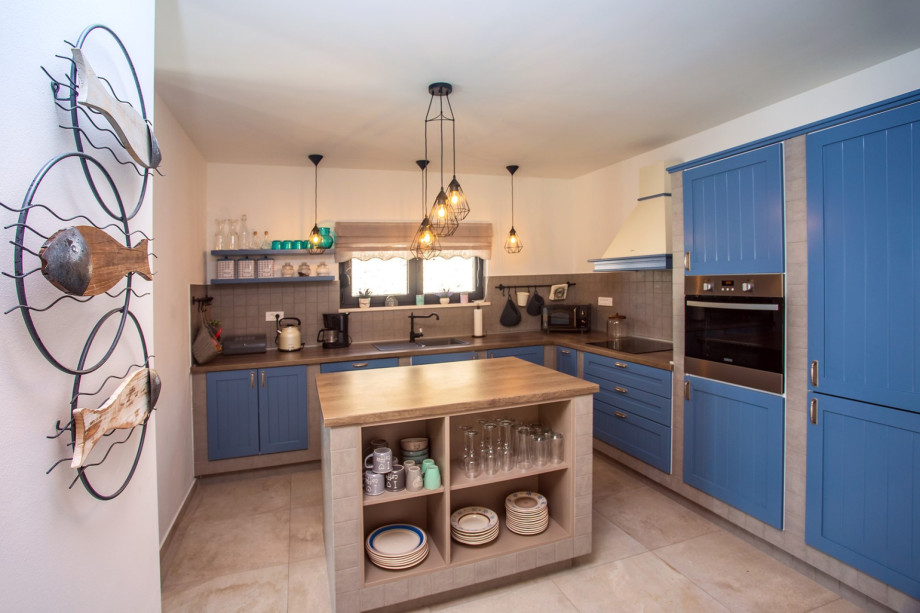 Fully equipped kitchen with all a modern guest might need for a comfortable stay