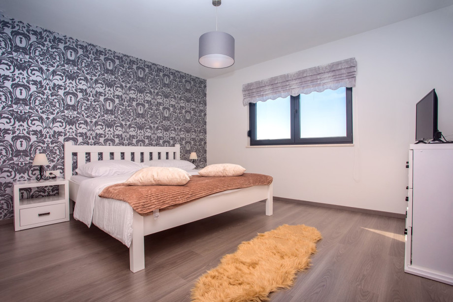 Bedroom No2 with king size bed, sofa bed for 1 person, exit to terrace with sea and pool view, A/C, TV, en-suite Bathroom No2 with shower