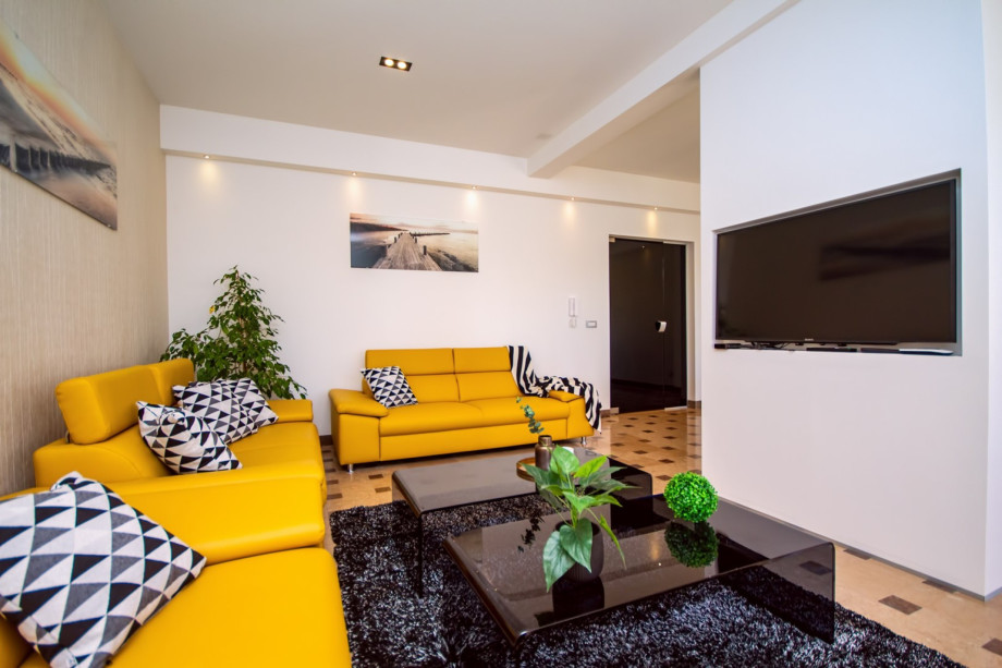 Comfortable dining and living area with direct exit to the outdoor dining area