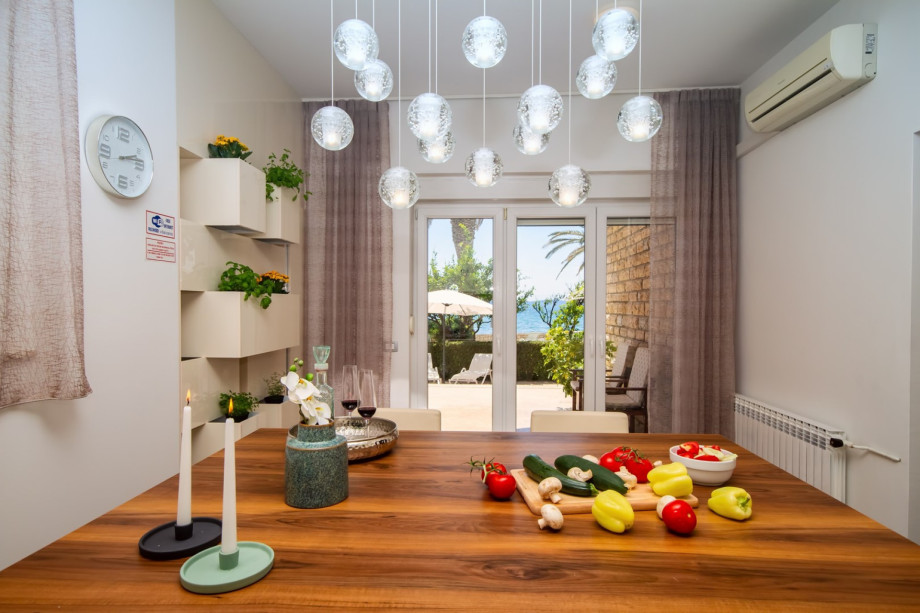 Fully equipped kitchen with exit to the outdoor dining area