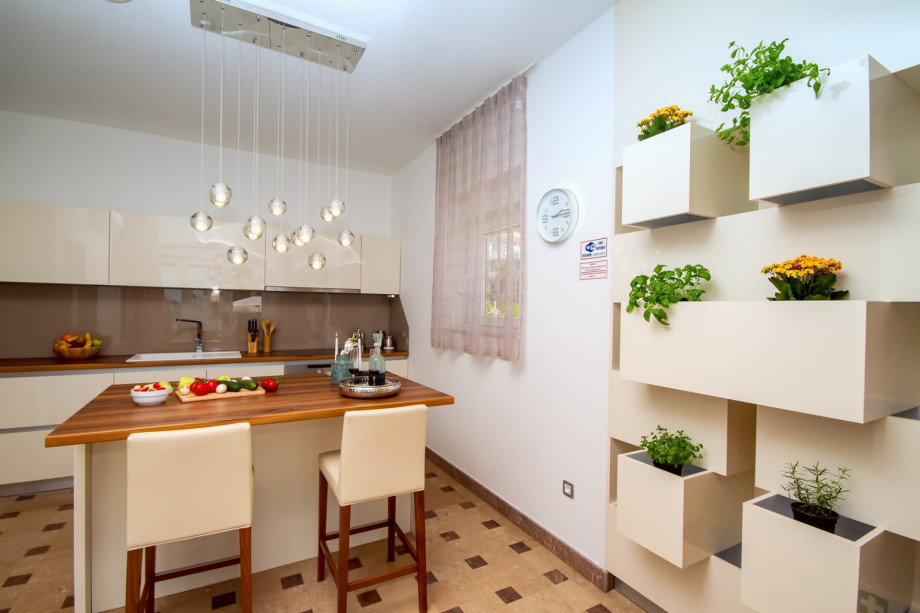 Fully equipped kitchen with exit to the outdoor dining area