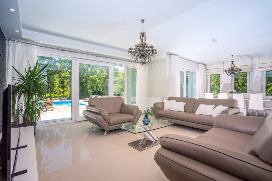 Very comfortable, air-conditioned living room with comfy sofas and a dining area