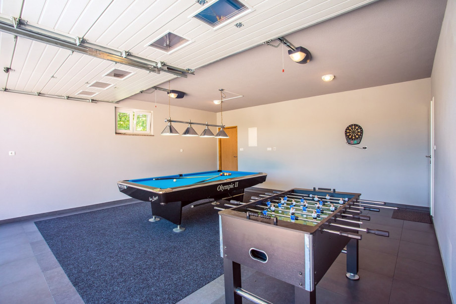 The fun area with PRO 9 Pool table, pool soccer, darts