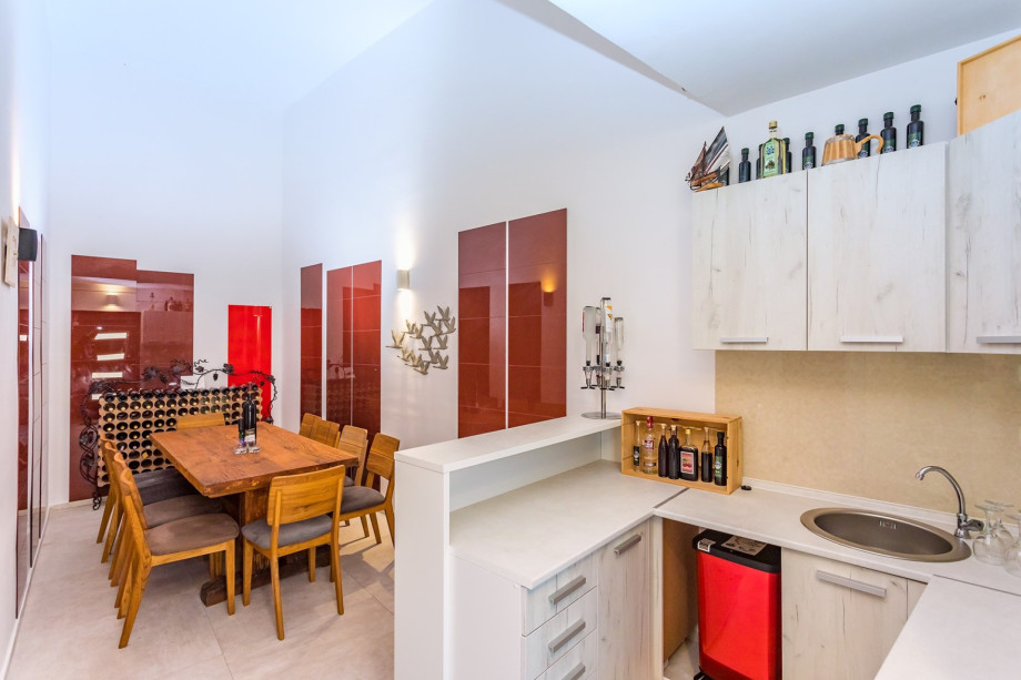 Another indoor dining area for 12 people with an electric barbecue