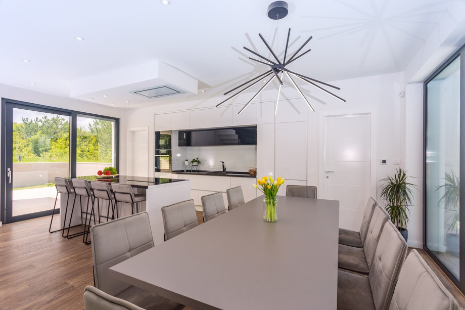 A dining area with exit to outdoor dining area