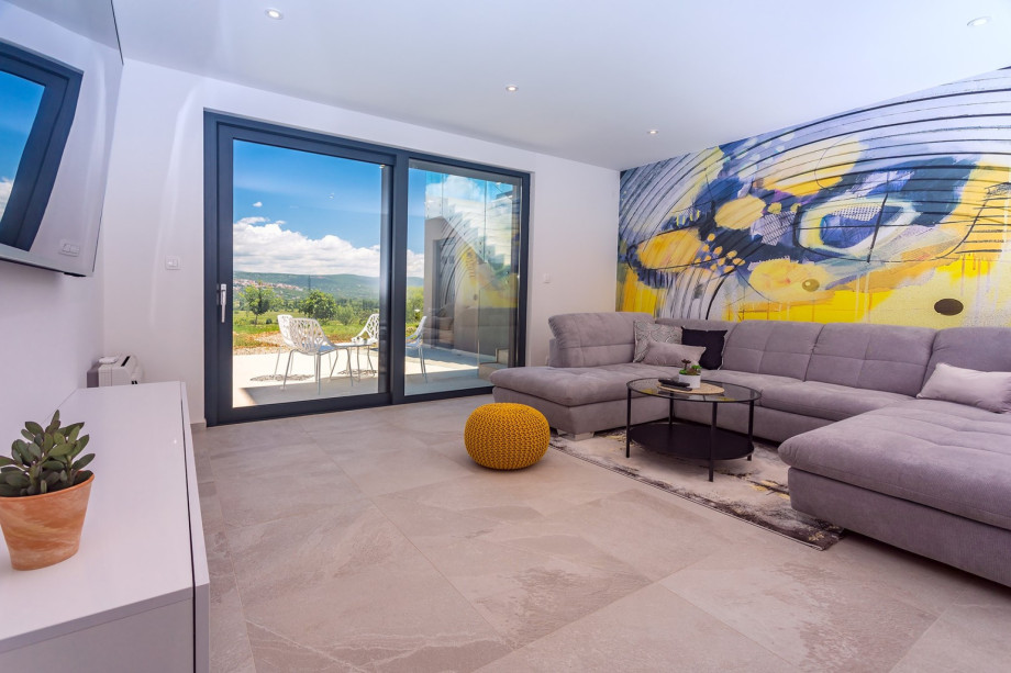 Game room with huge sofa (can open into comfy sofa bed for 2 pax), Air-condition and a big screen TV with PS4