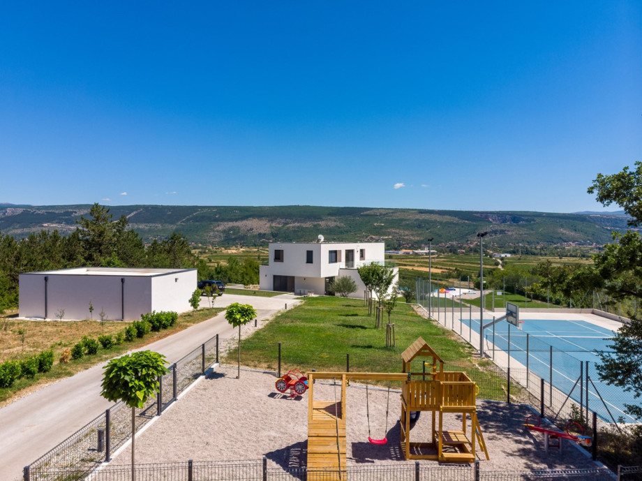 Playground for younger members of your group and offers a swing and a slide and a wooden house.
