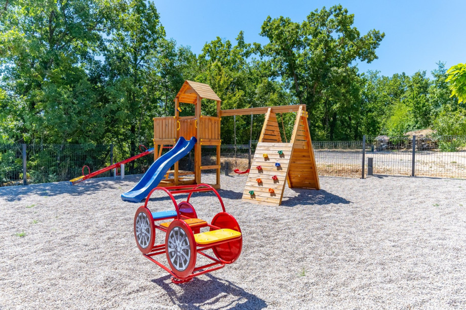 The playground for kids is fully fenced