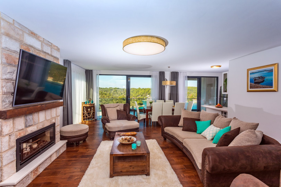 Opened plan living room and fully equipped kitchen