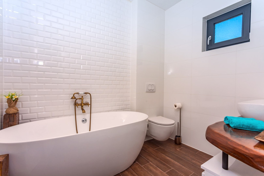 Family bathroom with bathtub