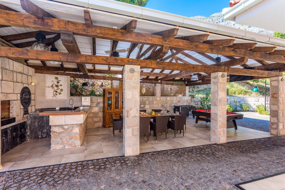 Covered outdoor dining area with  barbecue and Billiards
