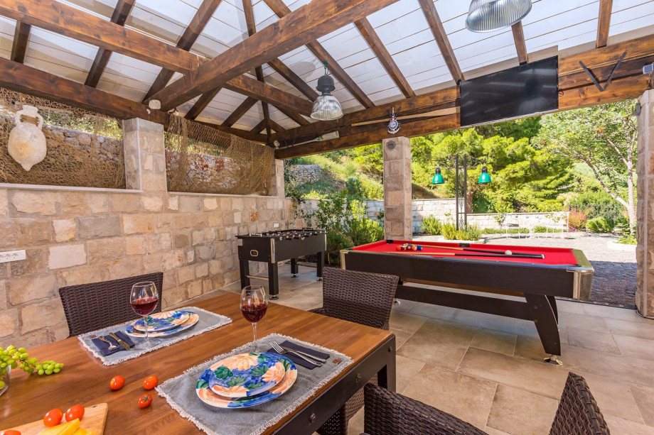 A covered area where you can enjoy a glass of wine and a good Billiard match