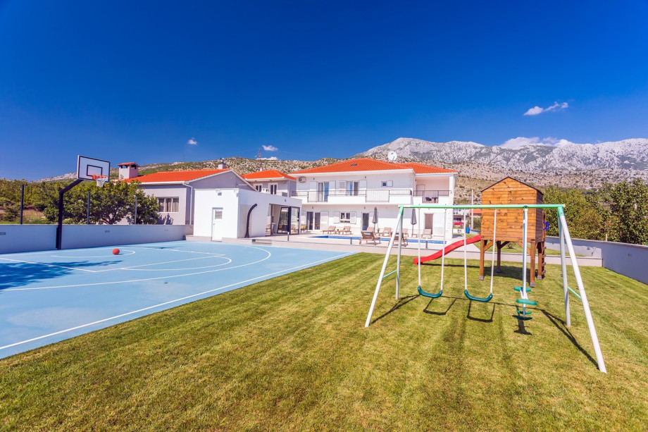 A playground for younger members of your group and offers a swing, a slide and a wooden house
