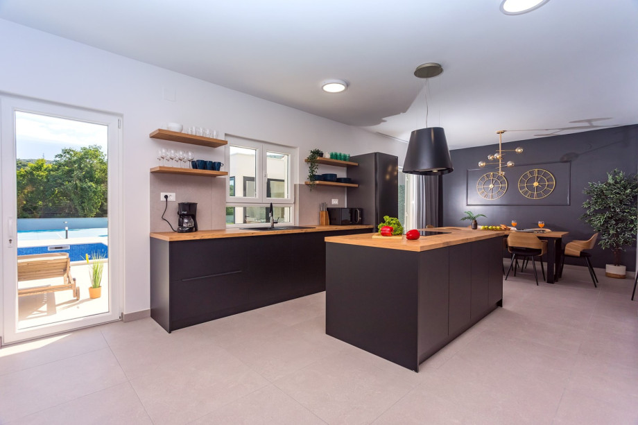 Fully equipped kitchen with pool views