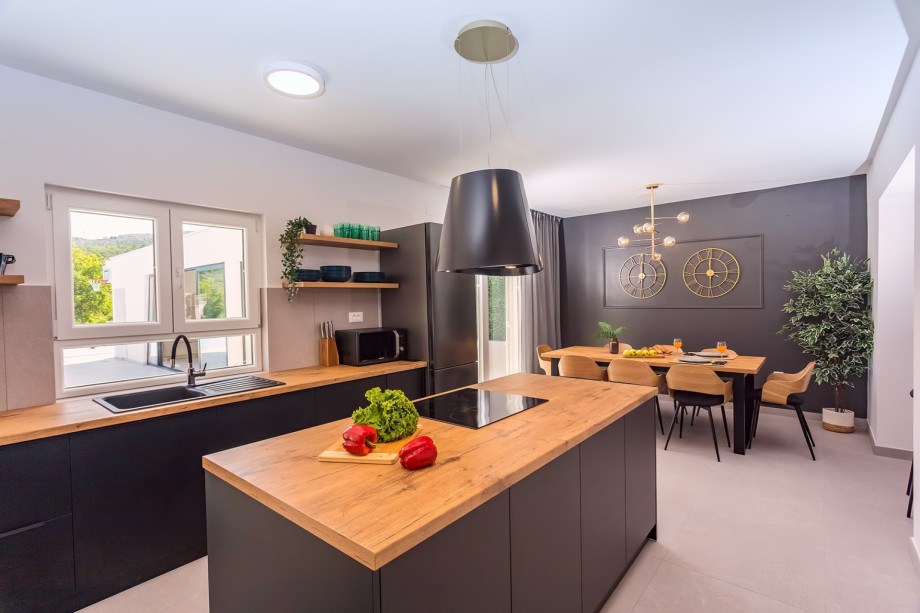 Kitchen is equipped with all that modern guests may need.