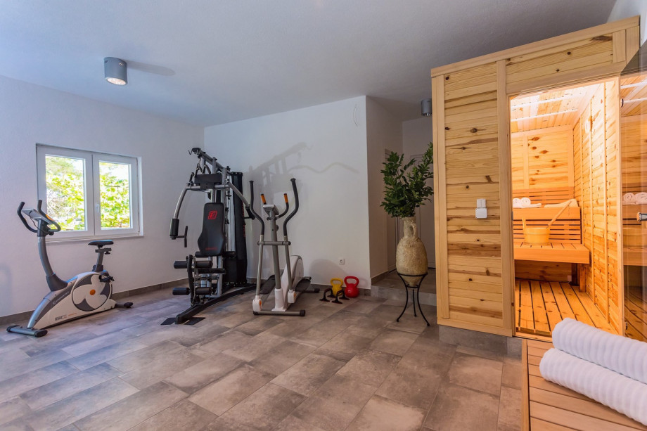 Finnish sauna, A/C, equipment for training, few steps down from pool area