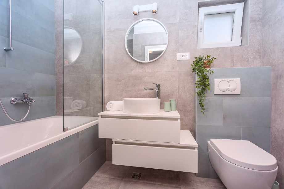A family bathroom with a bathtub