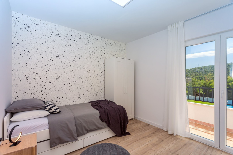 Bedroom No5 has exit to the balcony with mountain views.