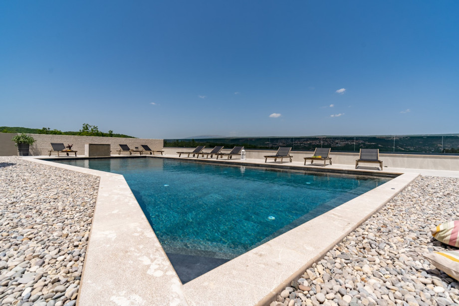 The sundeck area is spacious, partially covered with nice pebbles