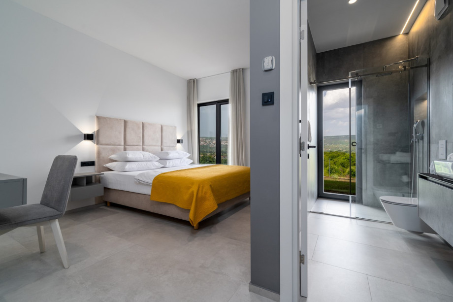 Bedroom No1 with a king size bed 180cm x 210cm, a TV, en-suite bathroom , and a make-up table