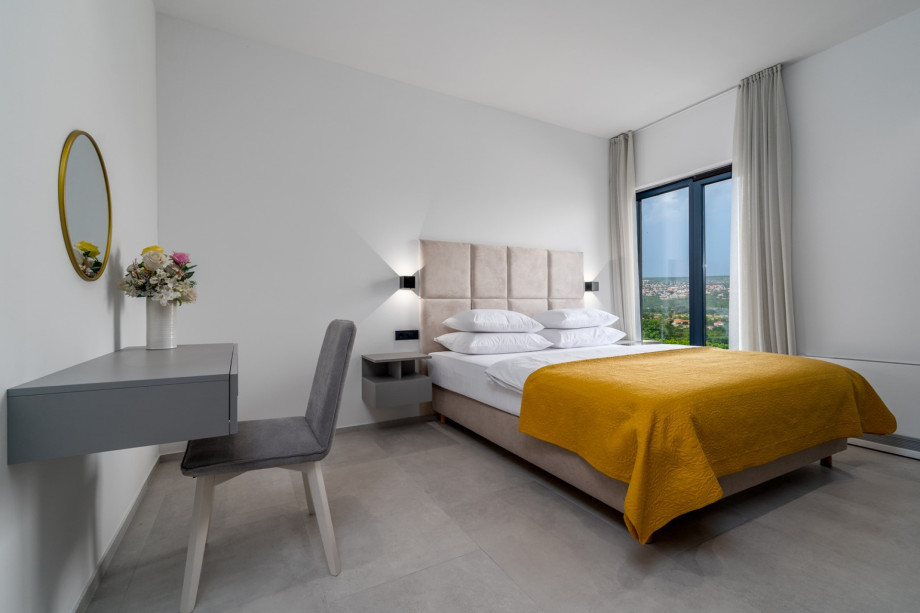 Each bedroom size is 23.5sqm, and from each you have a glass door toward the grassplot and toward the pool area