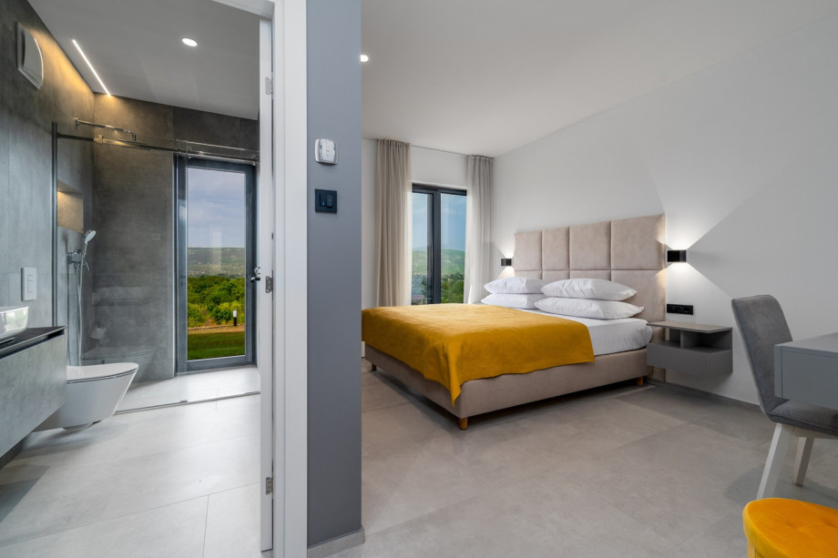 Bedroom No2 with a king size bed 180cm x 210cm, a TV, en-suite bathroom, and a make-up table