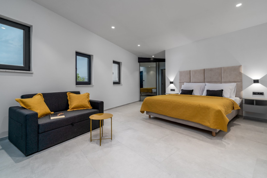 Bedroom No5 offers a king size bed 180cm x 210cm, en-suite bathroom with a shower, A/C, a TV and a PS, and a sofa bed (for two)