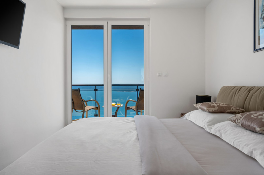 Bedroom No3 on the upper floor, a king size bed 180cm x 200cm, a TV, A/C, ensuite