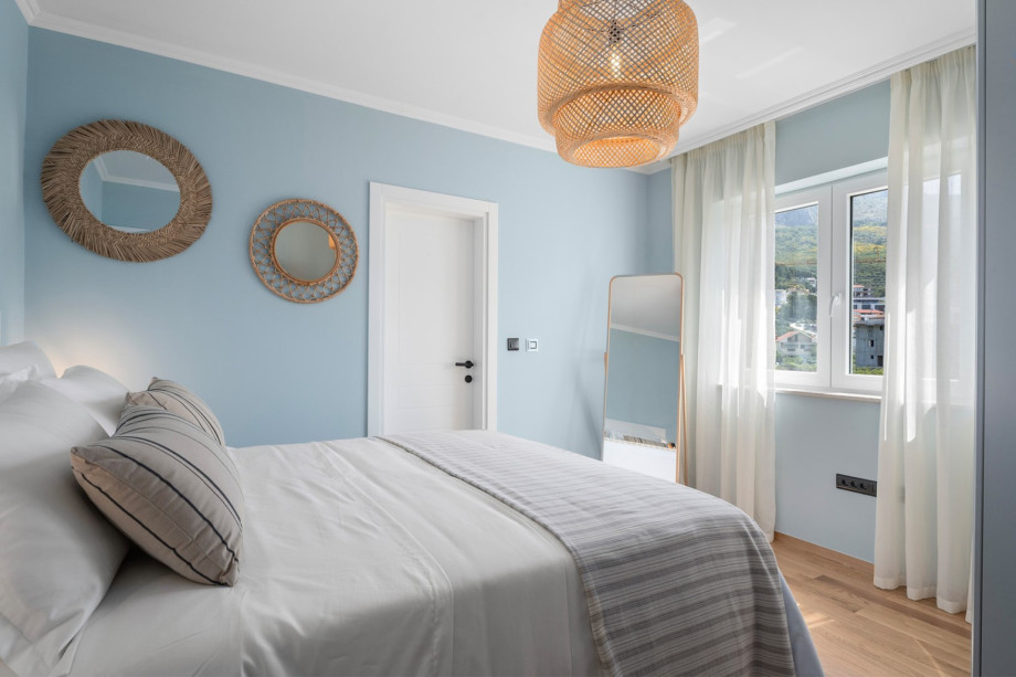 The first bedroom has a queen-size bed measuring 160 by 200 cm