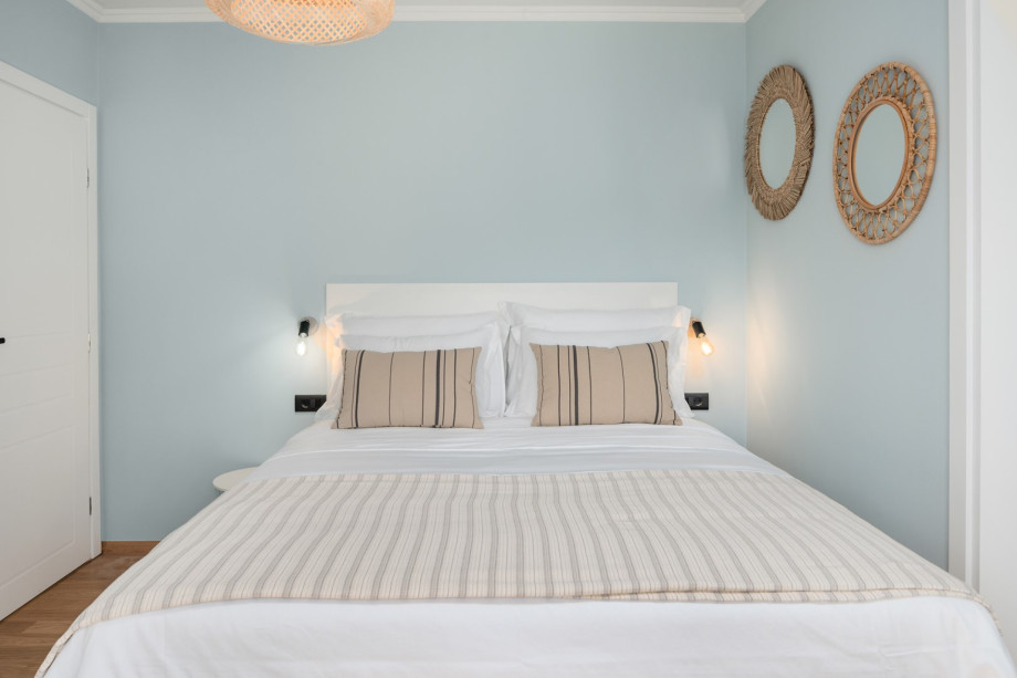 The first bedroom has a queen-size bed