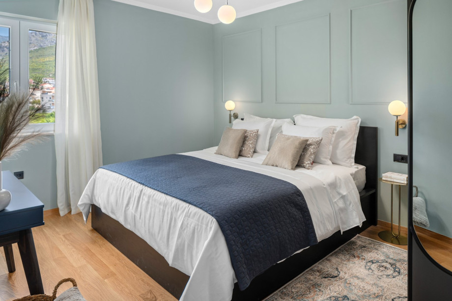 The second bedroom features a 180-by-200-cm king-size bed