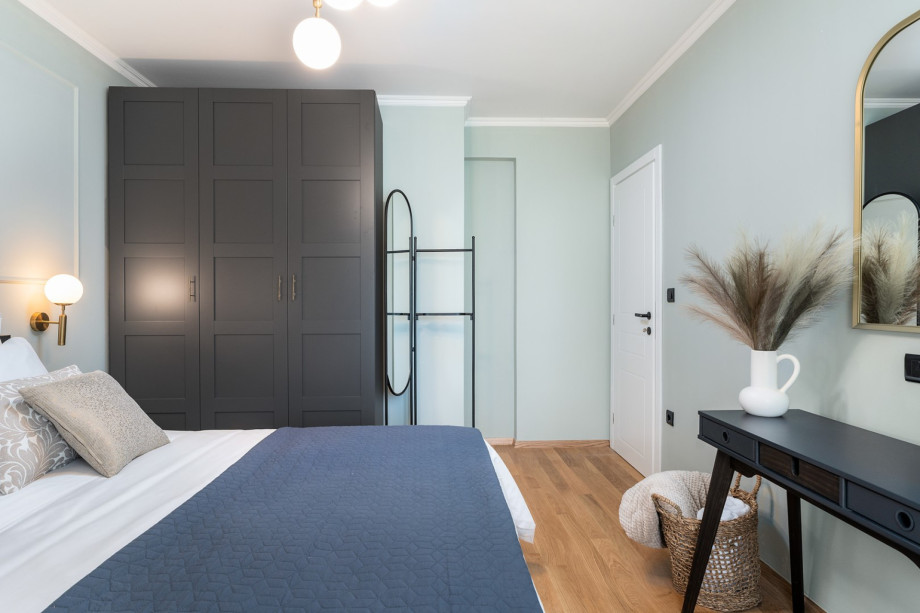 The second bedroom features a king-size bed