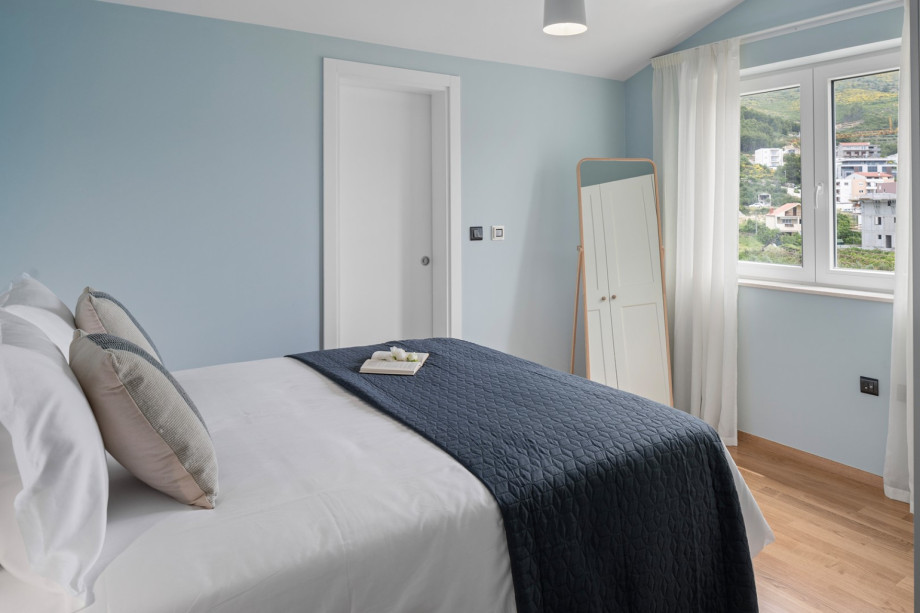 The first bedroom on second floor has an attached bathroom with a shower