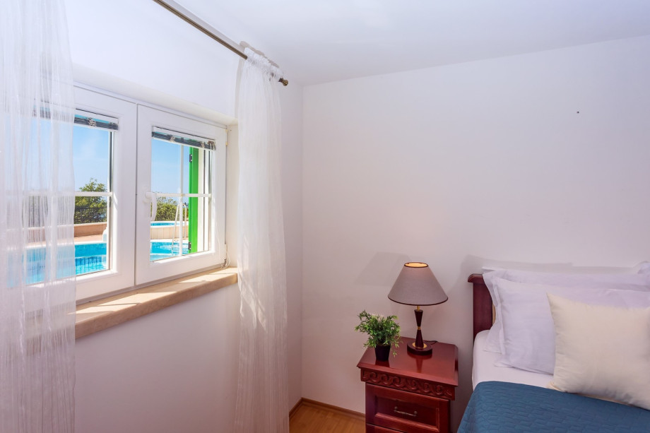 Bedroom No.2 with double bed and en-suite bathroom with shower (pool level)