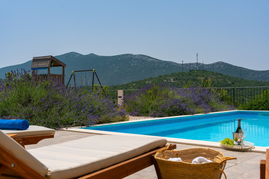The pool area overlooks the village  and an outdoor playground for kids.