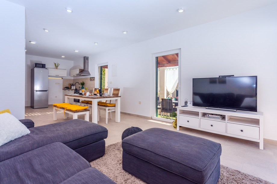 Living area with sofa, smart TV, PS4 for your youngest, free WiFi, fully airconditioned