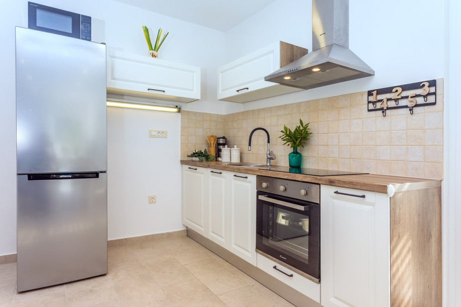 A fully equipped kitchen with all a modern guest needs for a very comfortable stay