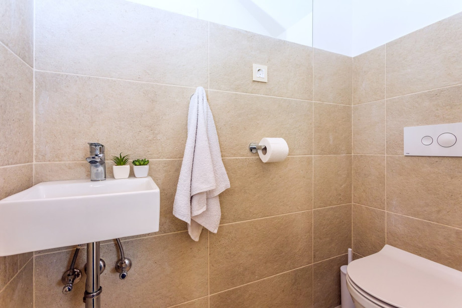 Separate toilet and a washing machine